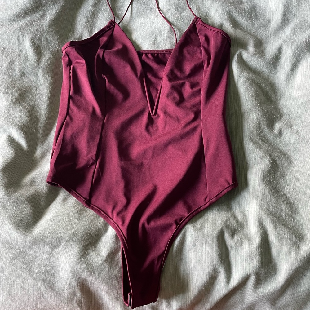 Red Bodysuit with Plunging V-Neckline and High-Cut Legs